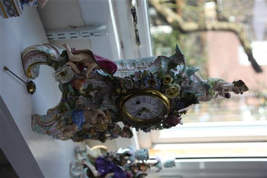 A large Meissen figural mantel clock, late 19th century, height 48cm, slight losses to flowers
